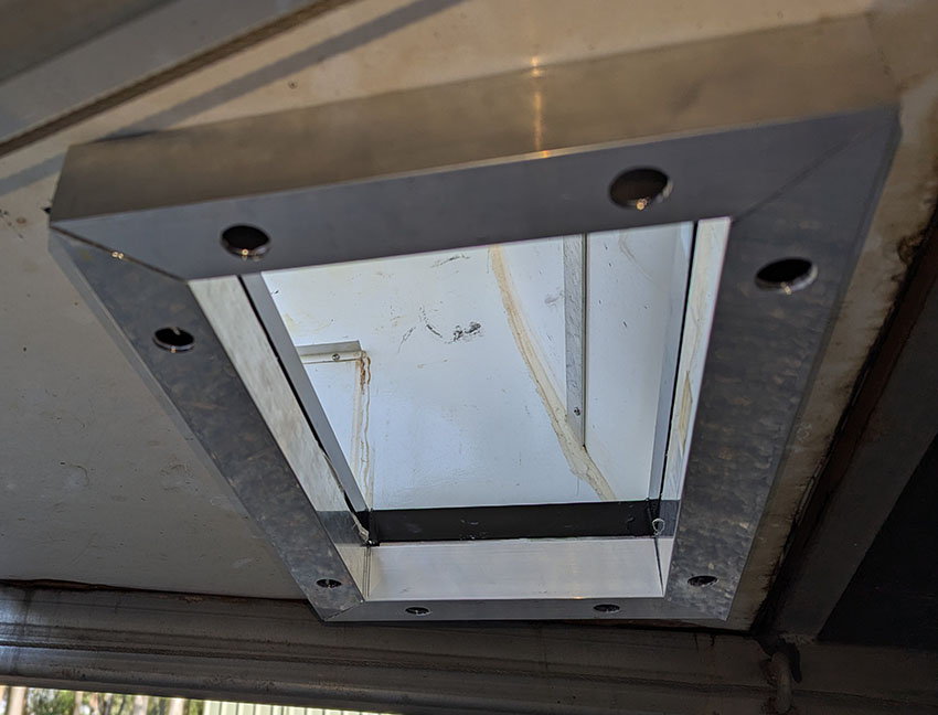 Box section aluminum supporting the open floor of the teardrop camper's toolbox