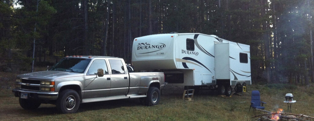 Image of Chevrolet dual rear wheel truck and a fifthwheel RV. Photo owned by Paso Robles RV Repairs 